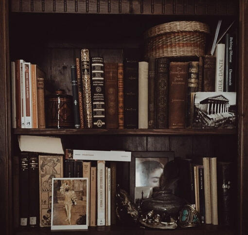 Bookshelf filled with books and knick knacks